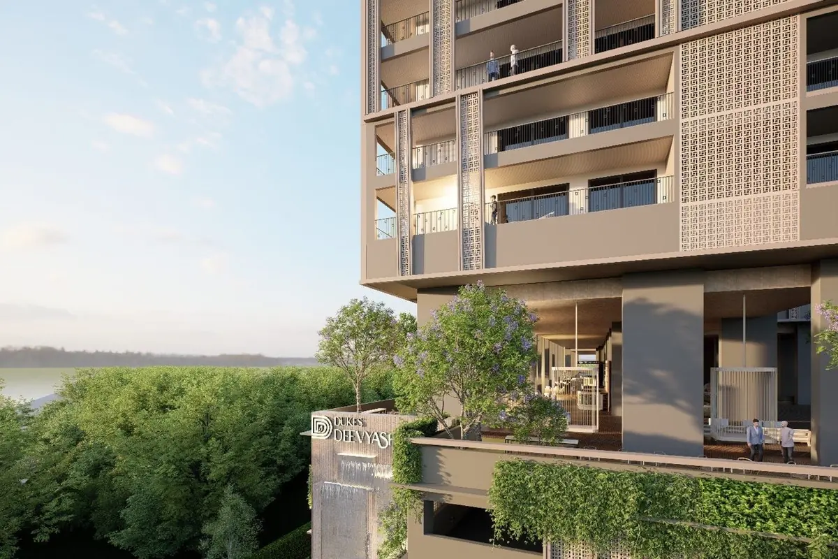 Wide balconies on the upper floors overlooking open land